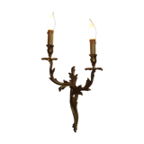 Bronze wall sconces decorated with acanthus leaves.