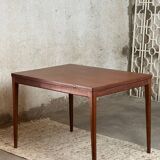 Extendable teak and teak veneer dining table