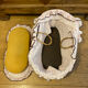 1960s wicker cradle with mattress and drapes.