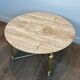 Brass coffee table with a white marble top.