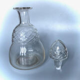 Old carafe in blown glass pattern engraved braces
