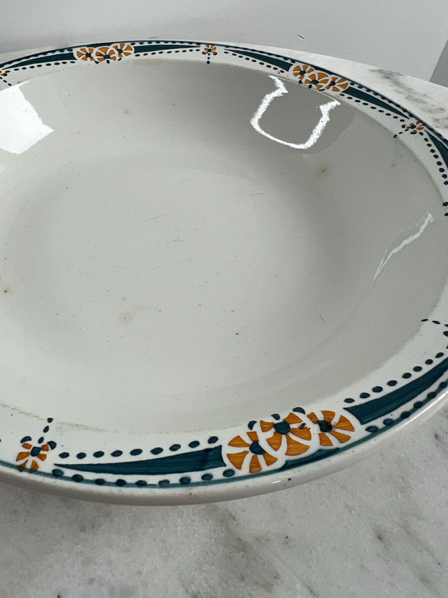 Longwy salad bowl with blue and orange floral decoration.