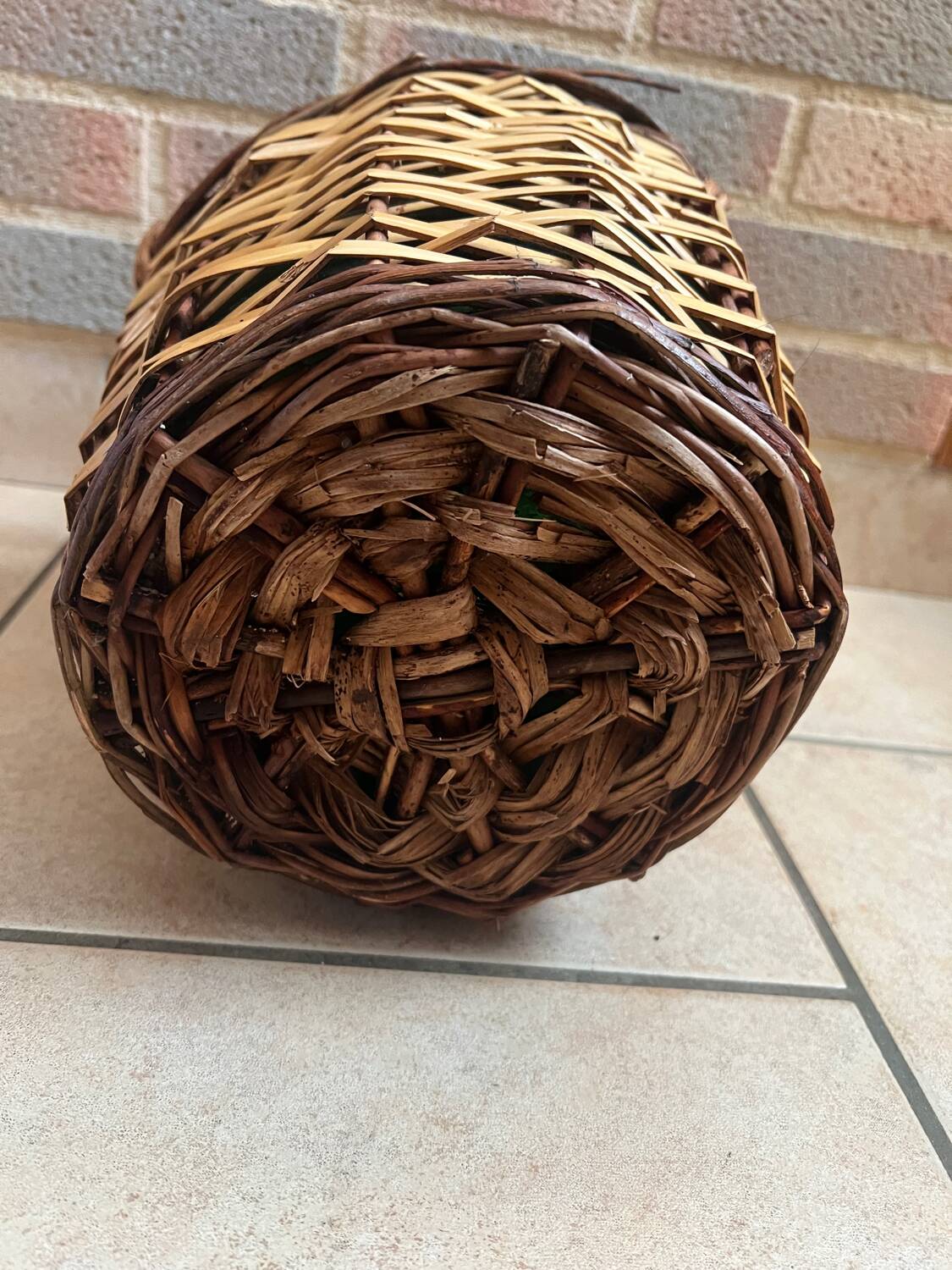 Old glass demijohn with wicker basket.