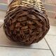 Old glass demijohn with wicker basket.
