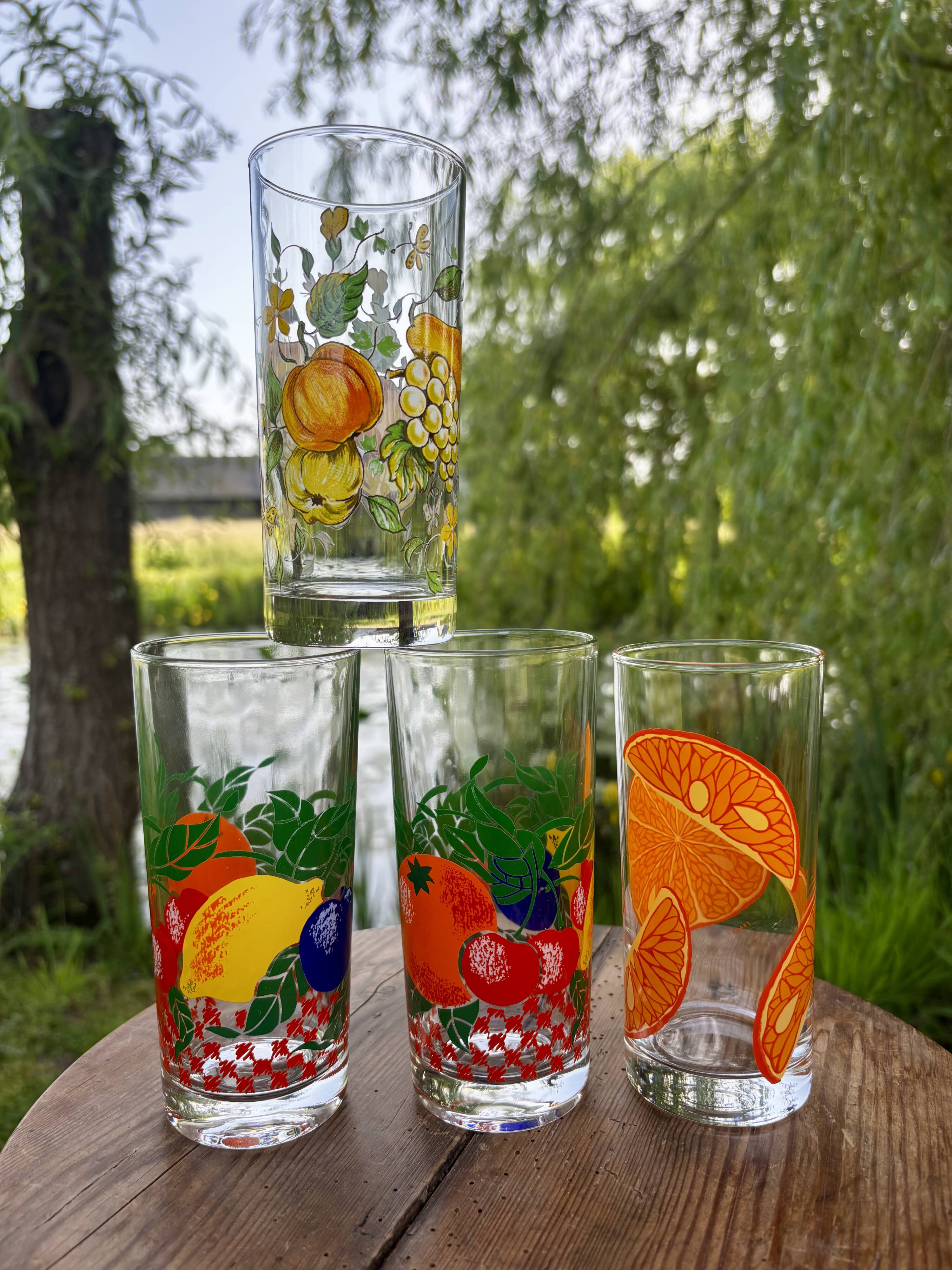 Vintage set of 4 fruit-decorated orangeade glasses.