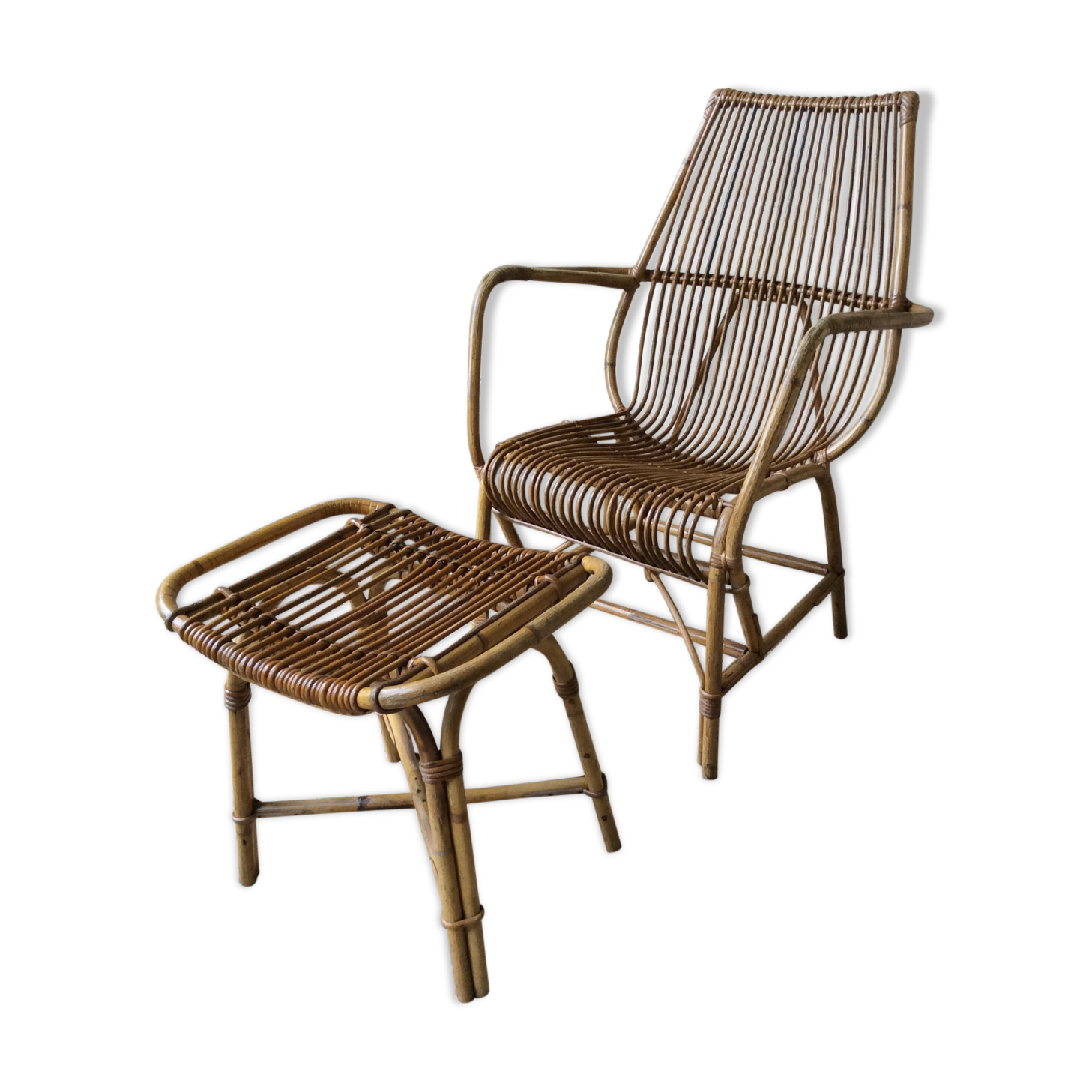 Rattan armchair and his feet rest