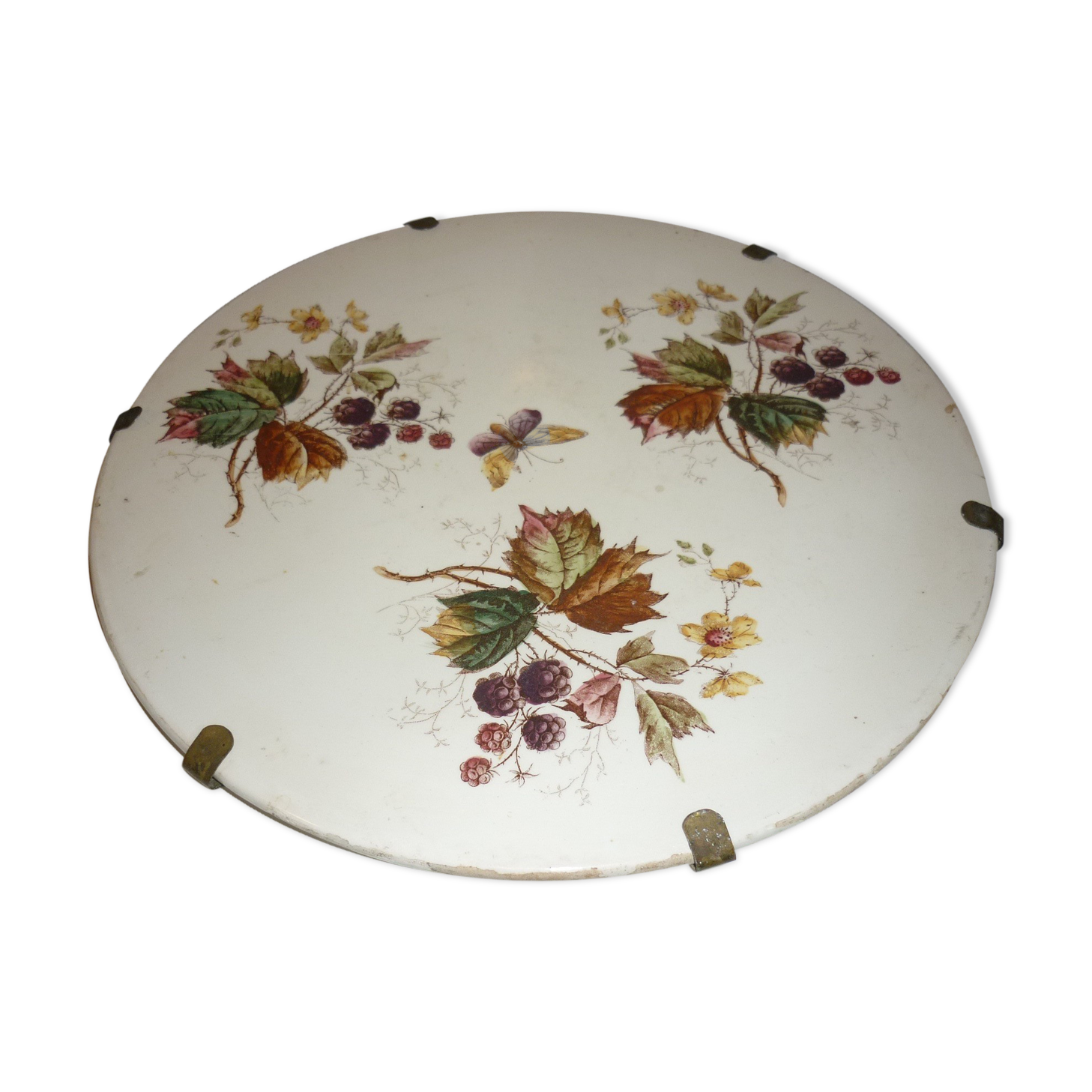 Ceramic plate underside on bronze stand