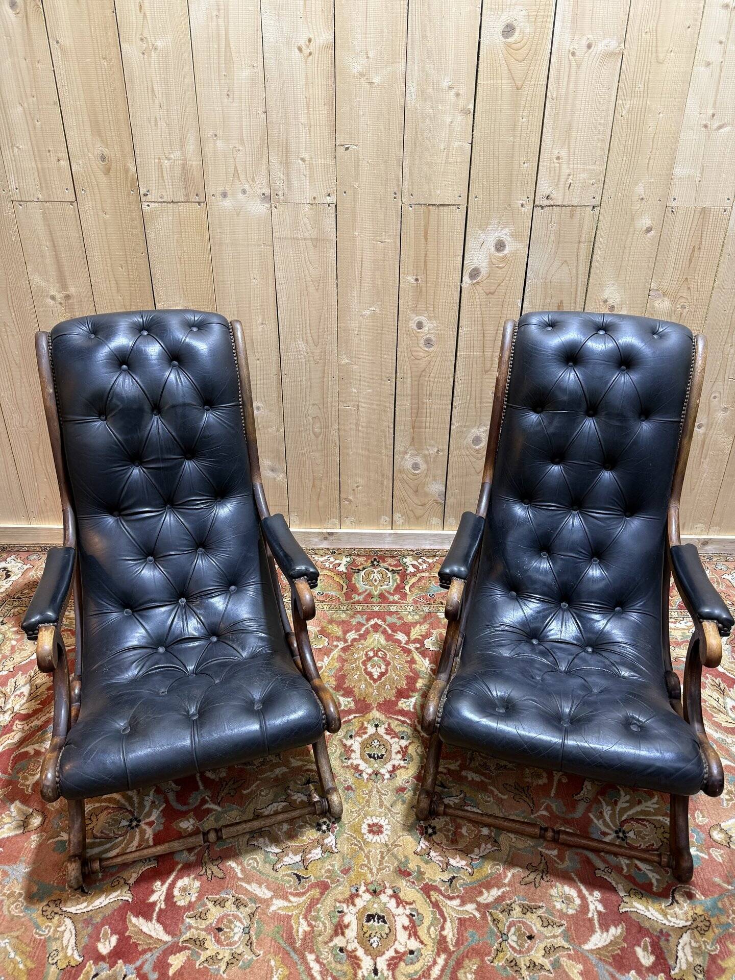Pair of English Chesterfield armchairs in black leather