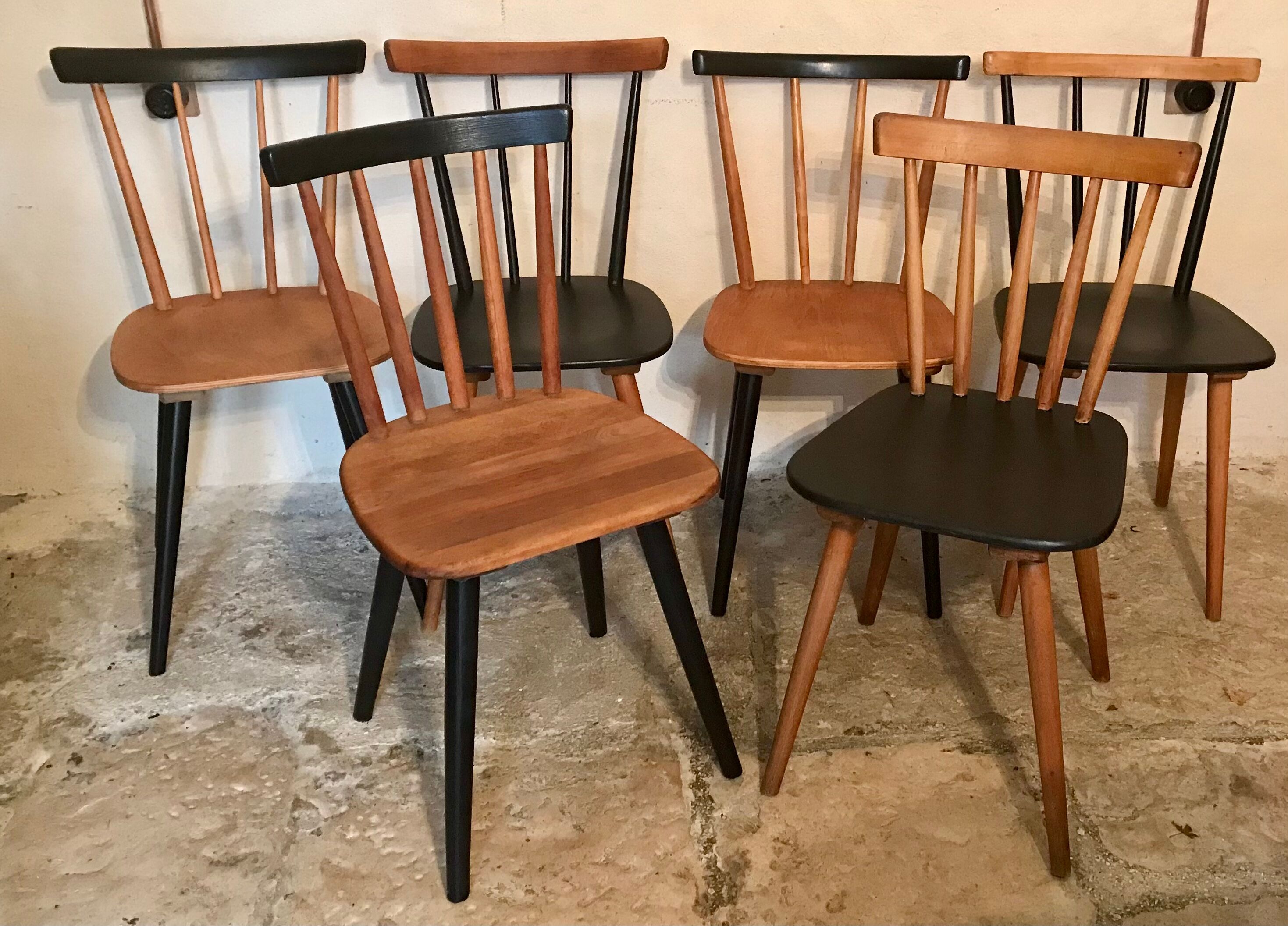 Set of 6 mismatched vintage chairs with bars and compass legs