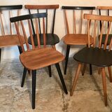 Set of 6 mismatched vintage chairs with bars and compass legs