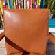 Low armchair, brown imitation leather