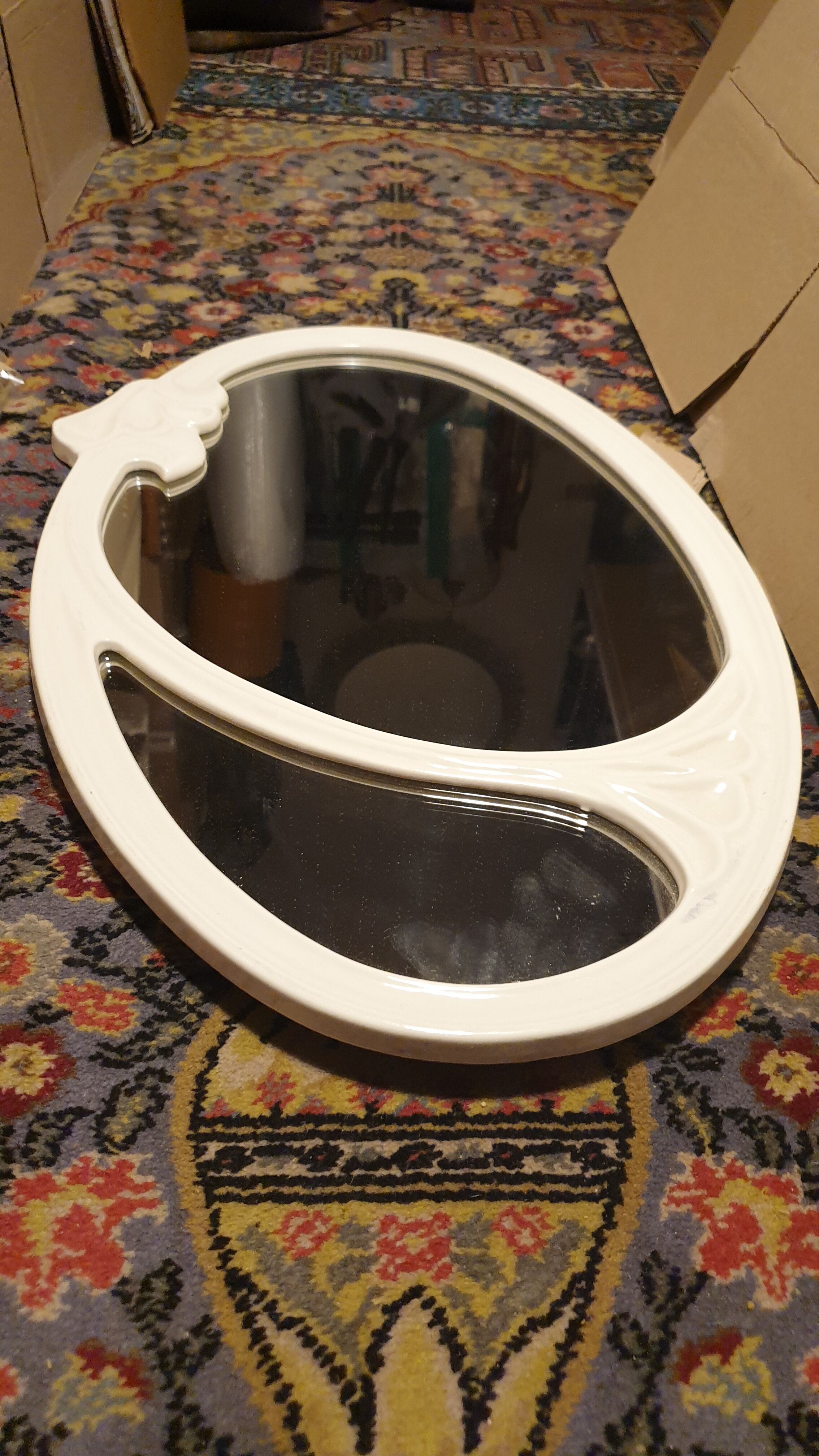 Oval cast iron mirror