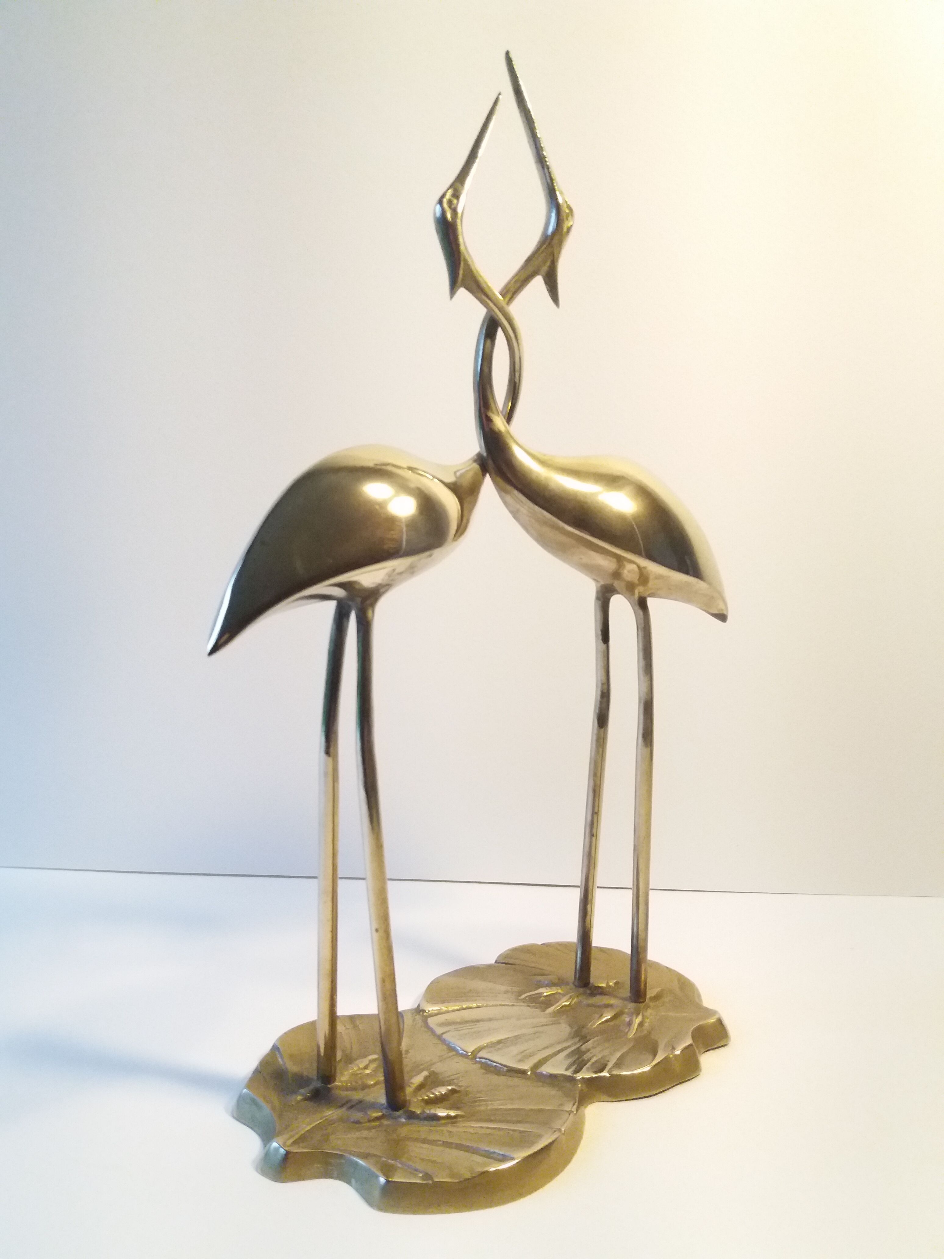 Herons entwined brass