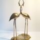 Herons entwined brass