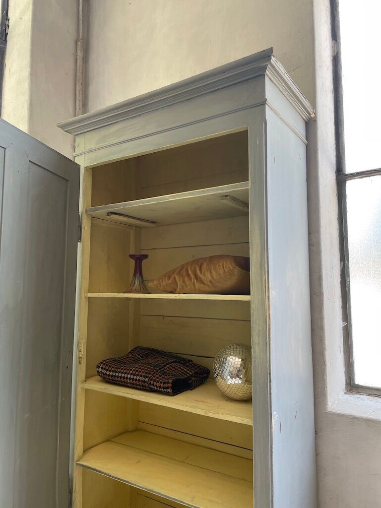 Blue patinated cap cabinet