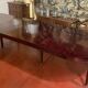 Directoire period extendable dining table in mahogany with a band.