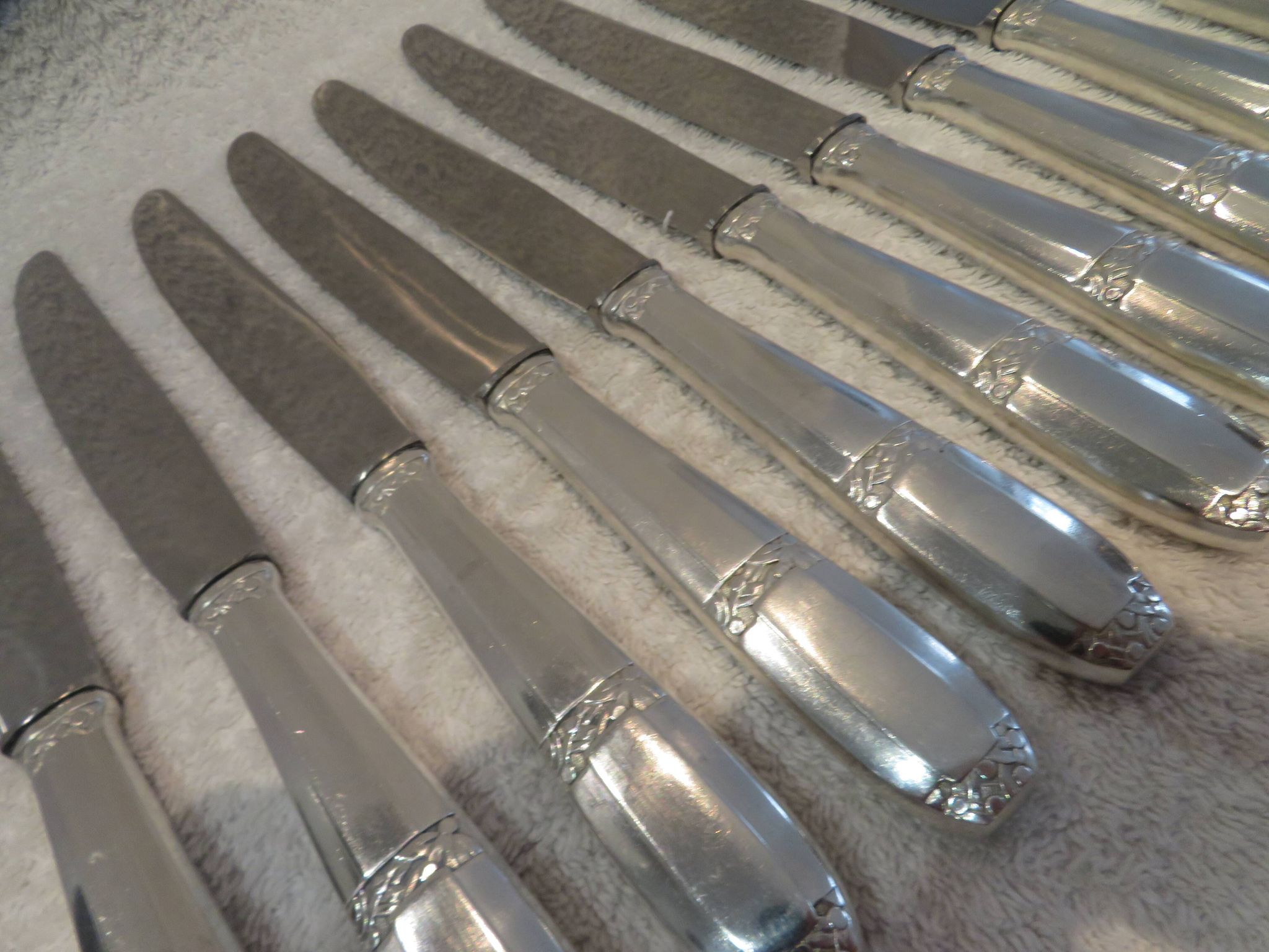 12 silver plated table knives by Argit goldsmith? Art Deco floral bands