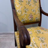 Louis XV style cabriolet armchair in solid wood, yellow floral fabric.