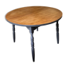 Round wooden table with integrated extension