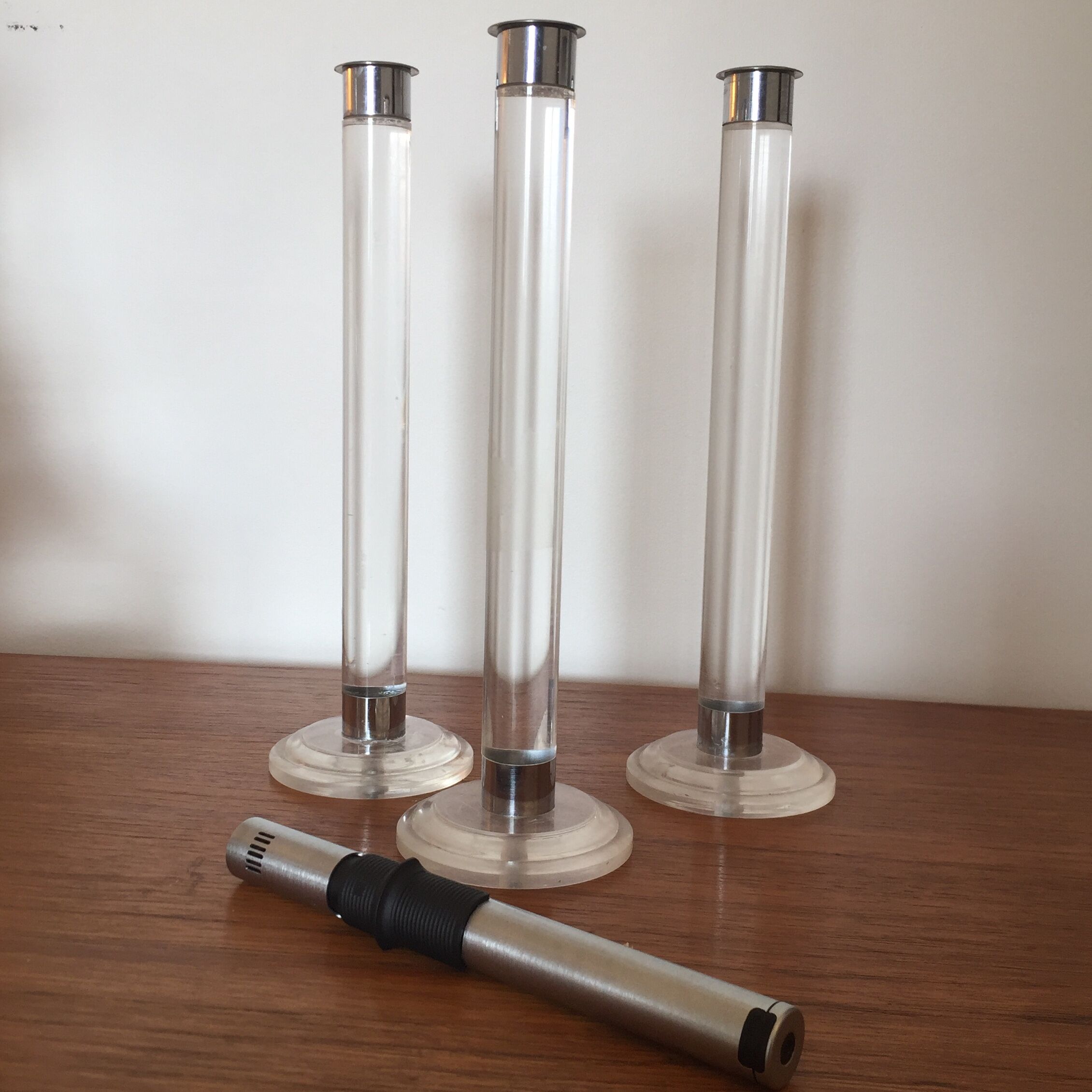 Serie of three candlesticks in Plexiglas and metal 1970