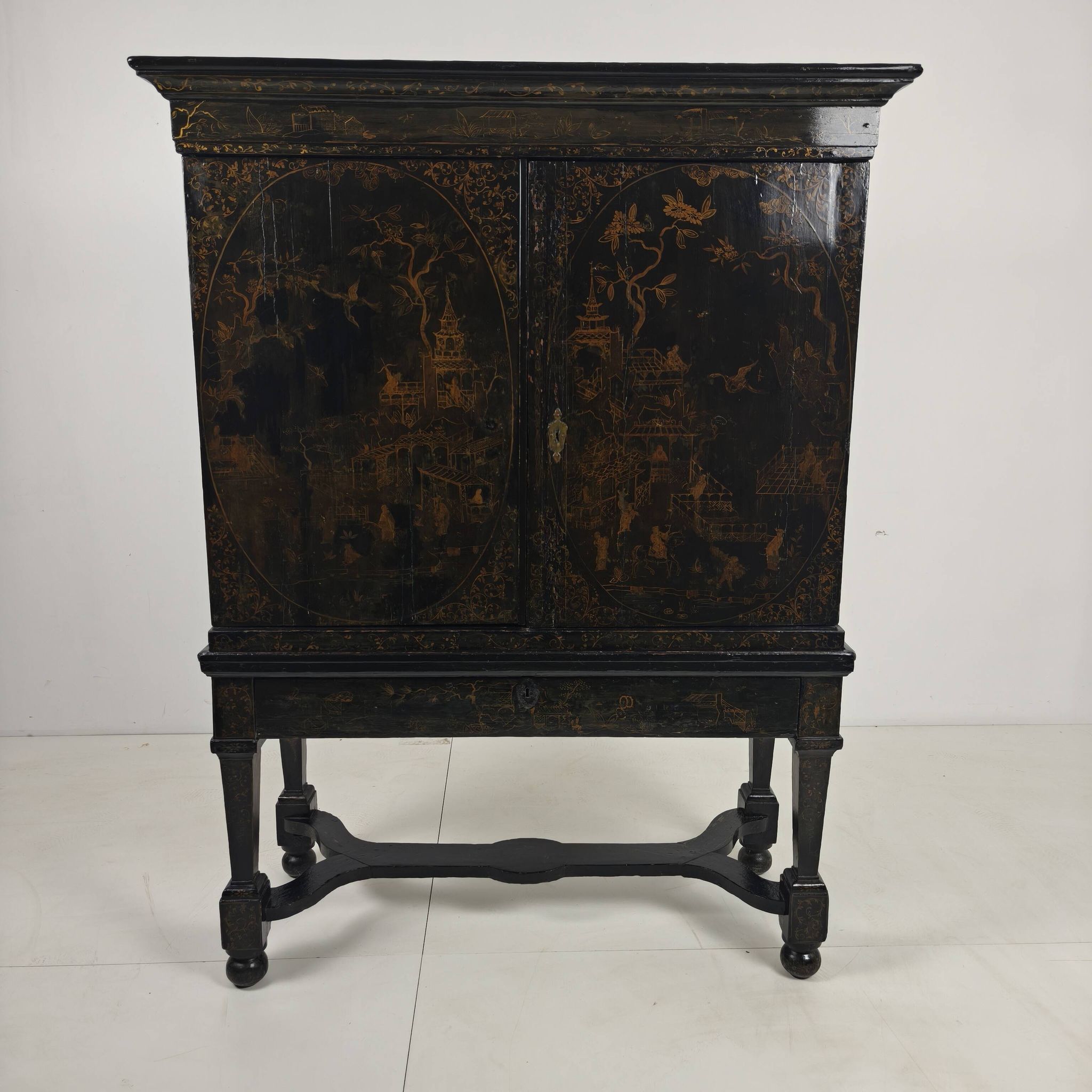 A rare early 18th-century Dutch japanned chinoiserie cabinet, circa 1700