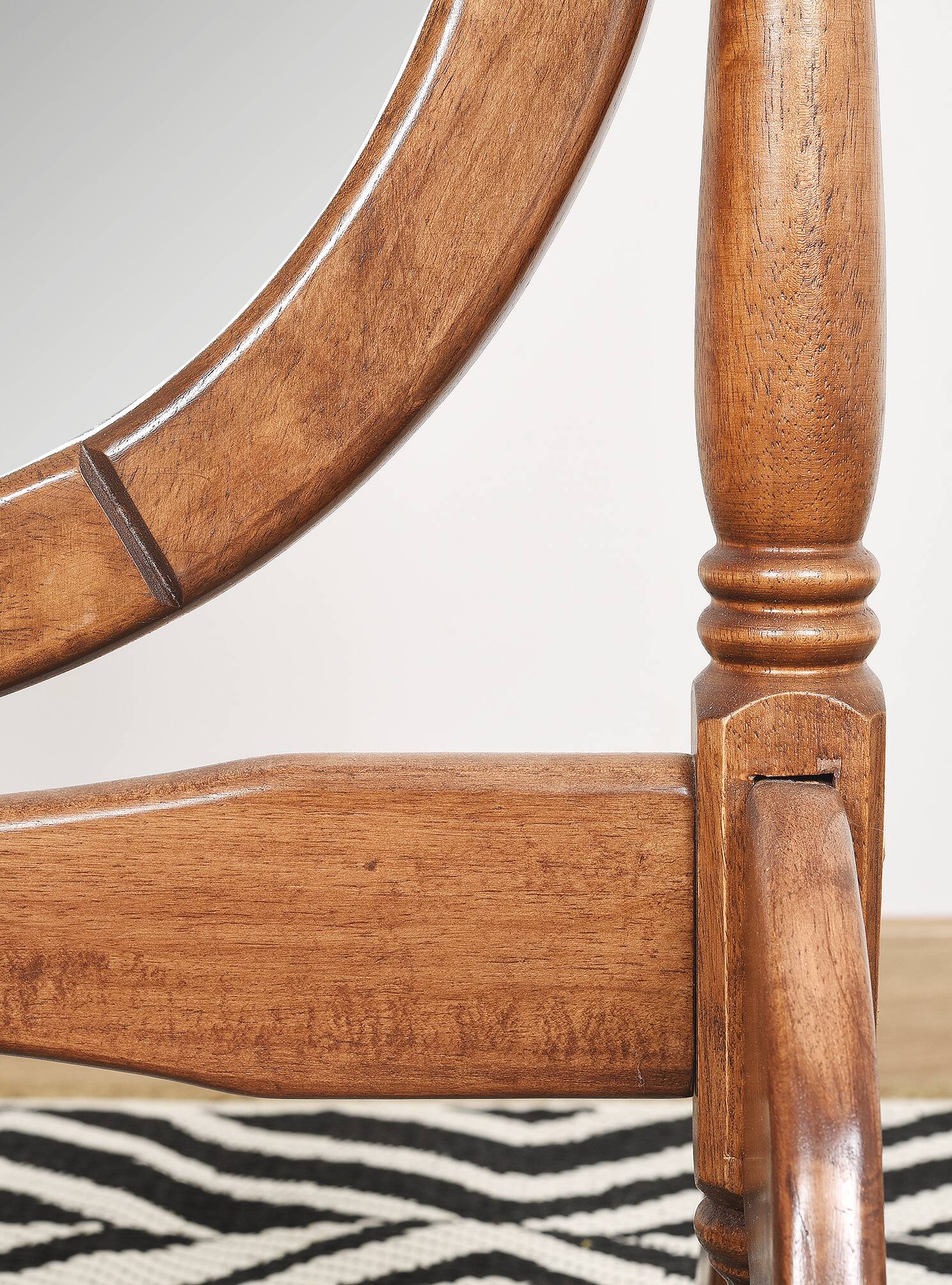Large psychic mirror on legs with pivoting oval frame.