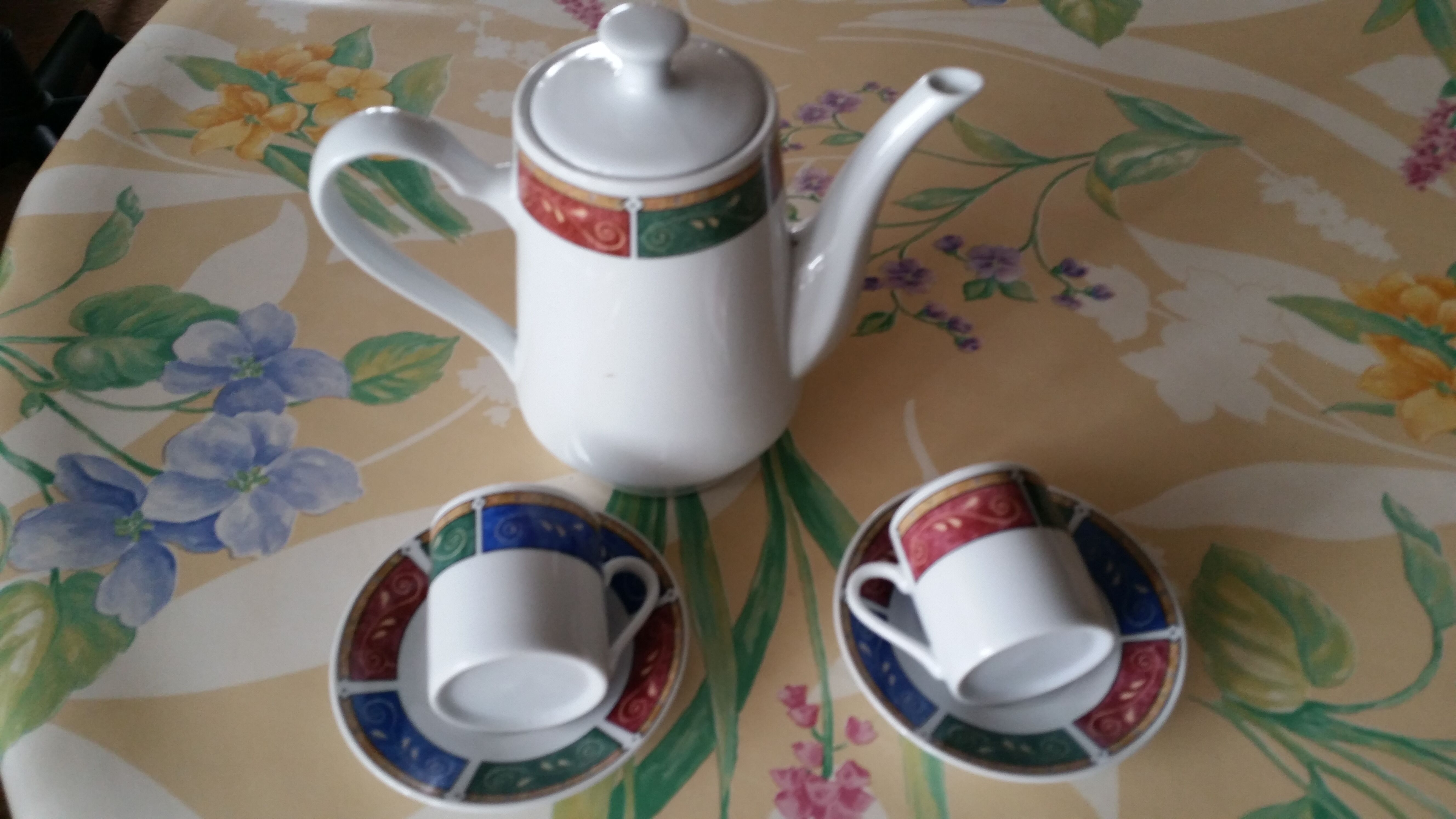 Coffee service cups saucers and coffee maker