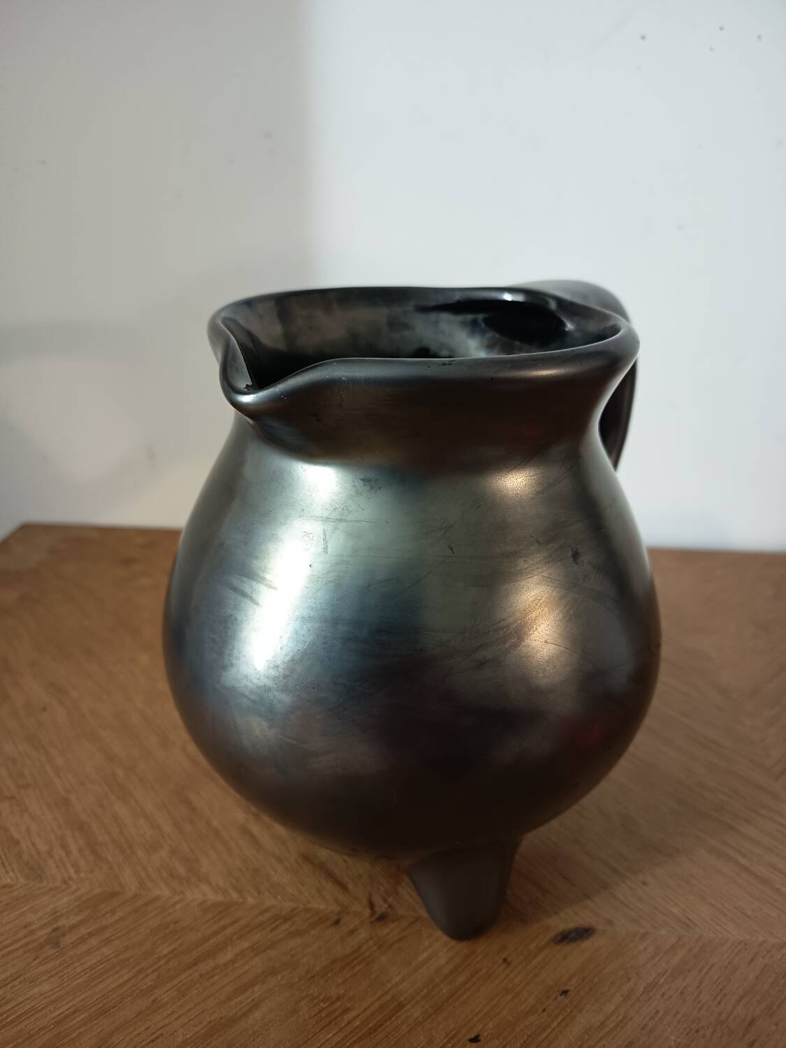 Black ceramic tripod jug