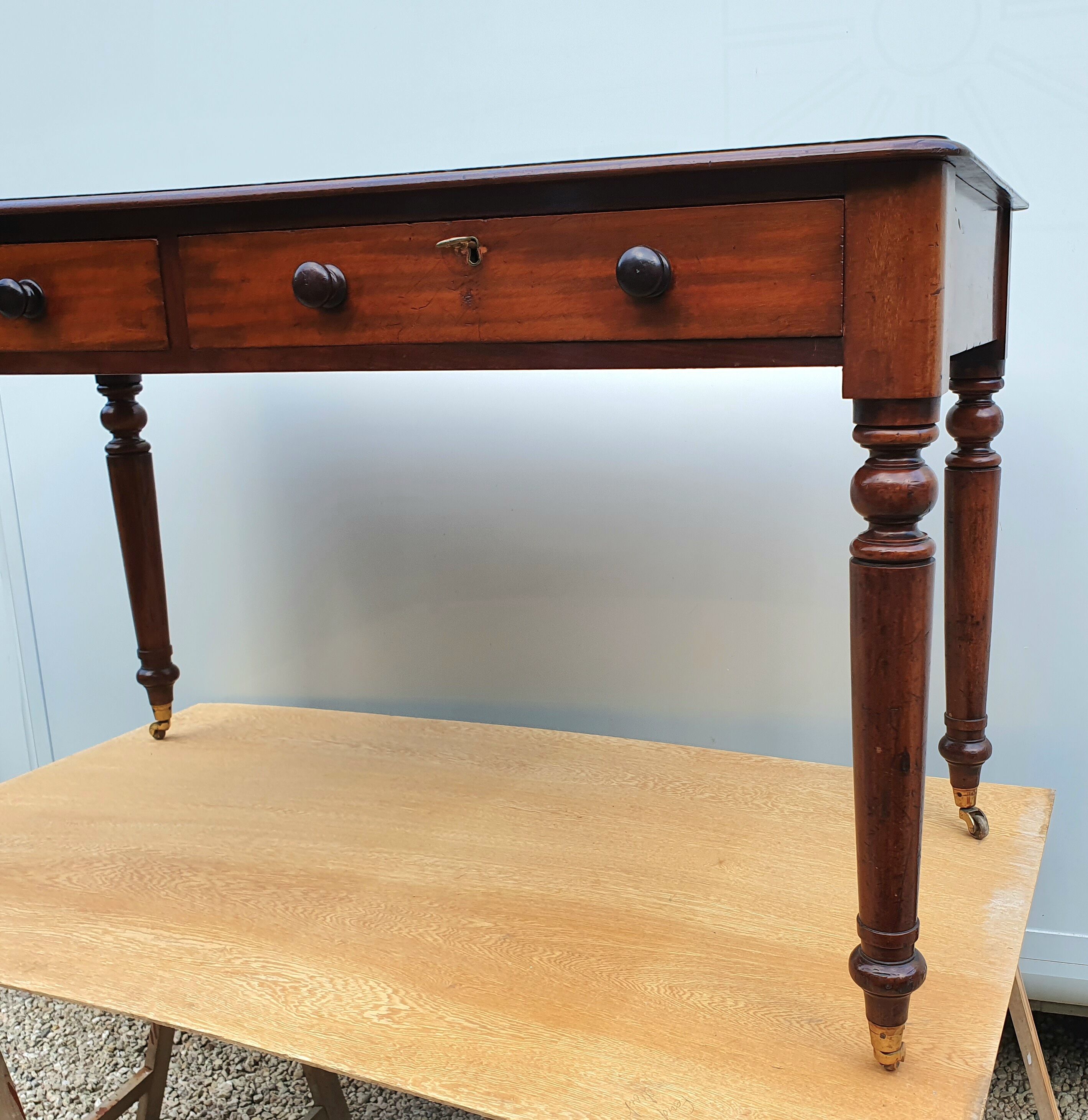 English desk with 2 drawers on green leather