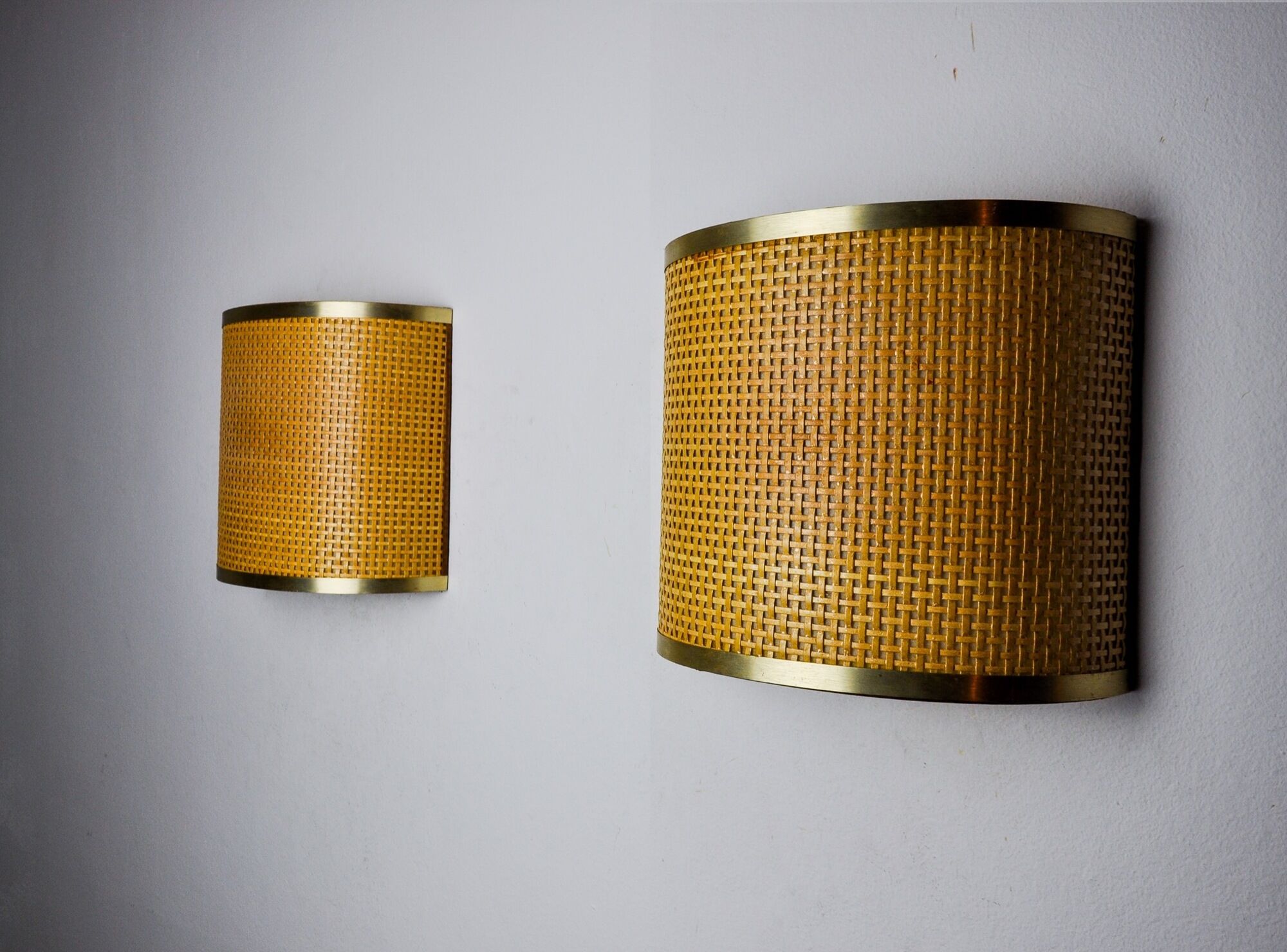 Pair of rattan and brass appliques, Italy, 1960