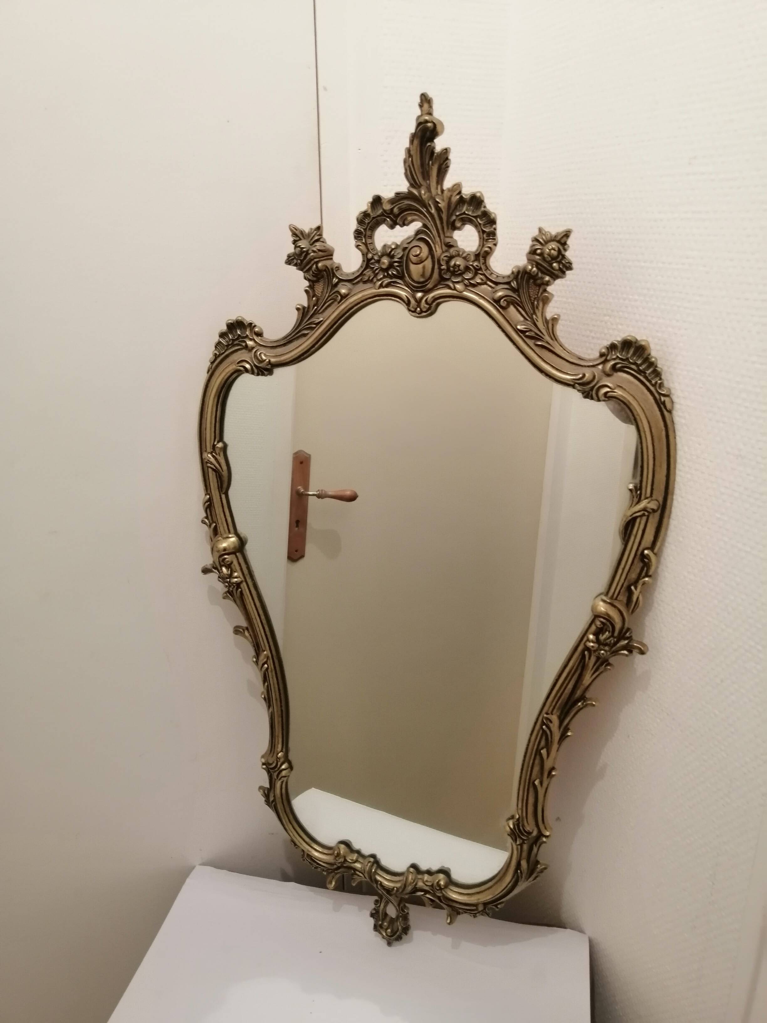 Wall mirror with gold patina ornaments