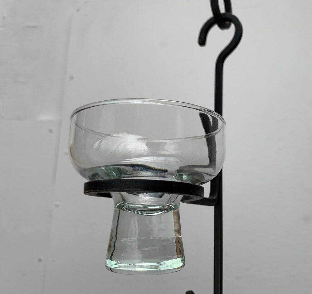 Mid-century metal and glass pendant light from the 1960s.