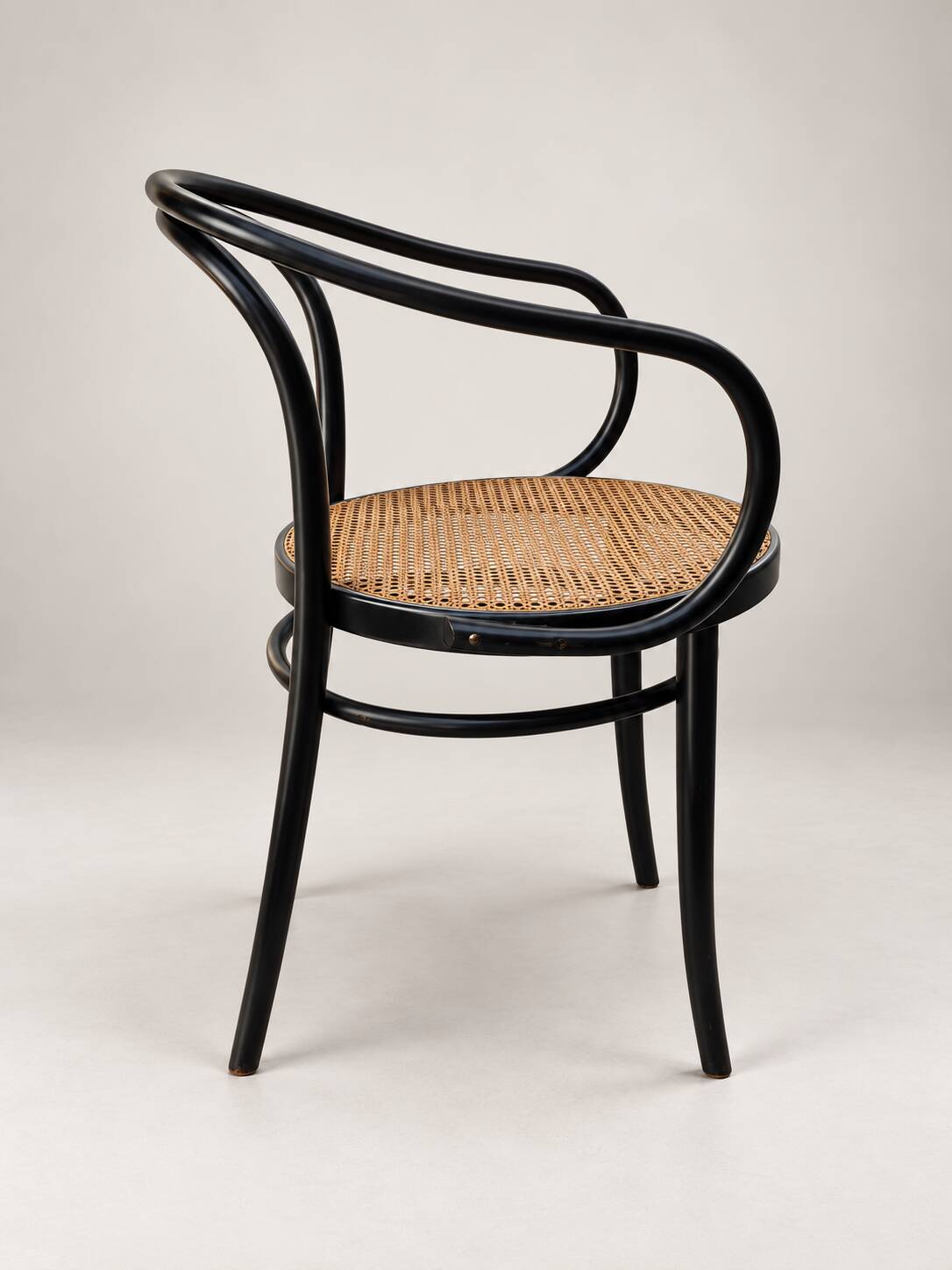 Thonet armchair in bent wood and caning – Czechoslovakia