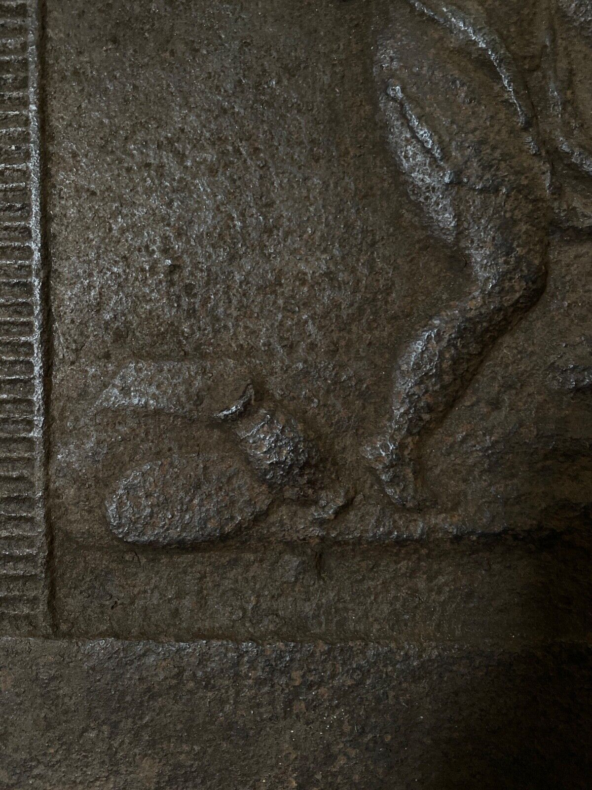 EIGHTEENTH CENTURY CAST IRON FIREPLACE PLATE REPRESENTING A WOMAN AND A WOLF