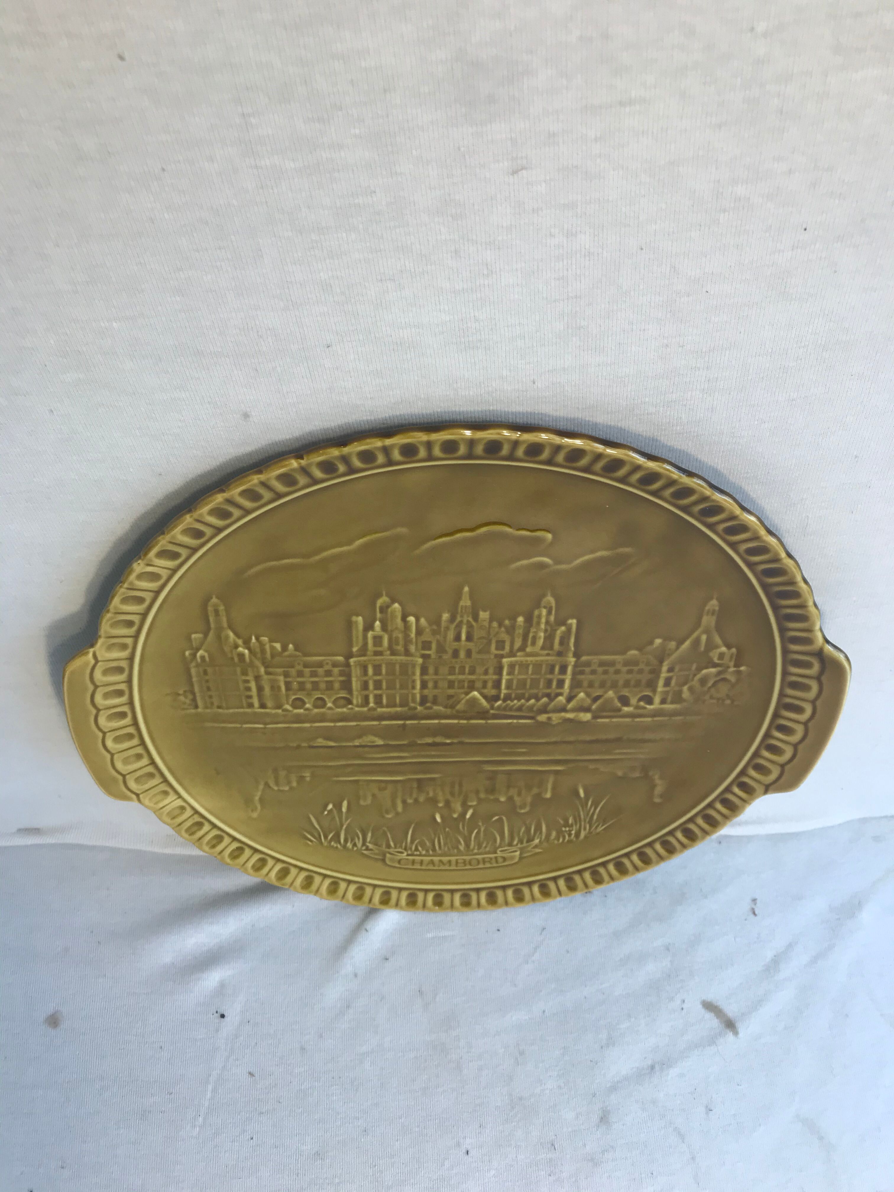 Old dish Gien, drawing chateau chambord in relief and vintage green ceramics