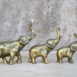 Three brass elephants
