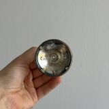 Small shiny metal candle holder