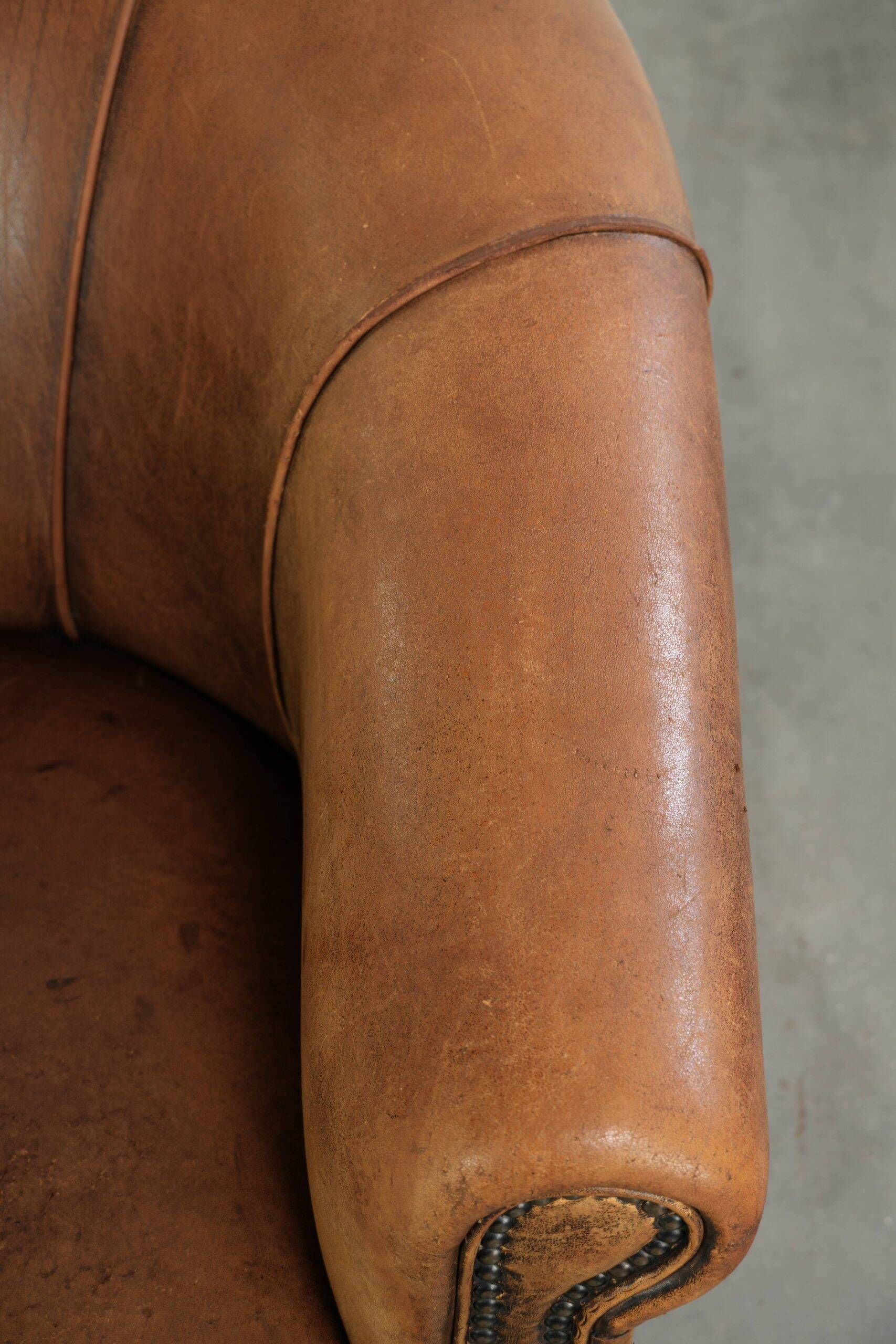 Vintage sheepskin clubchair in a beautiful cognac colour with a sturdy look