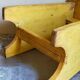 Art-populaire workshop stool in patinated painted wood