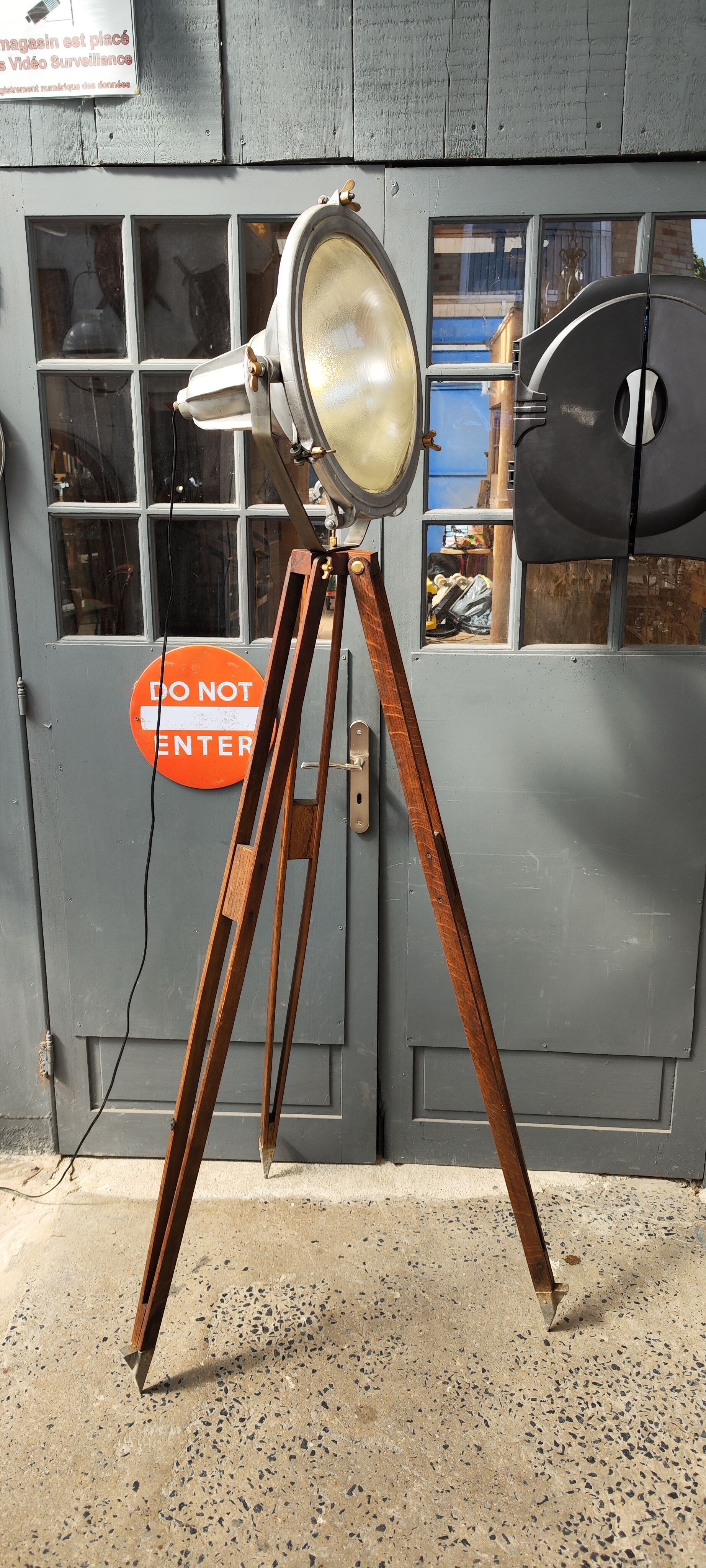 Industrial projector on tripod waxed wood