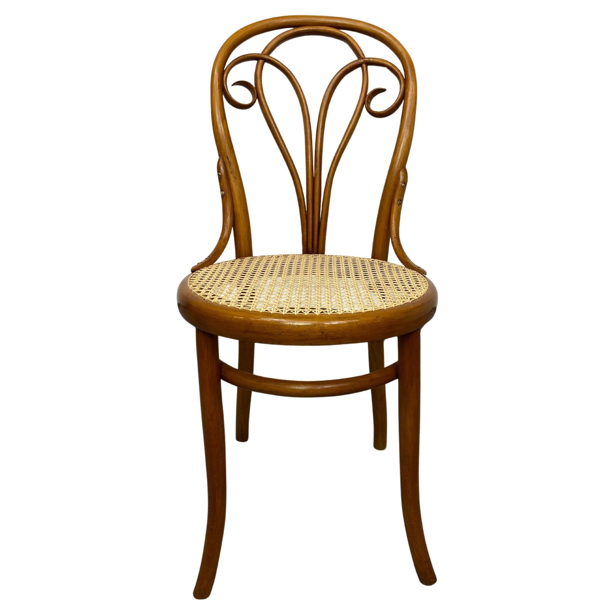 Curved wooden dining chair by Löbl Wieisskirchen