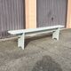 Pair of wooden benches painted white, French artisanal work.