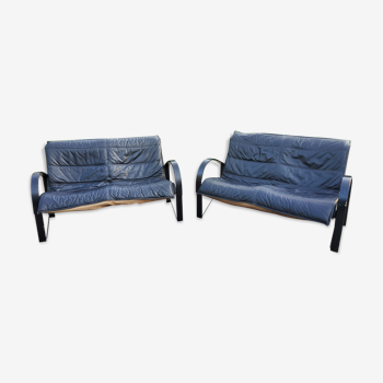 Pair of Scandinavian 2-seater sofas from the 70s in leather and wood