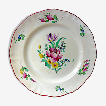 Eastern earthenware plate with floral decoration centered with a rose