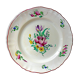 Eastern earthenware plate with floral decoration centered with a rose