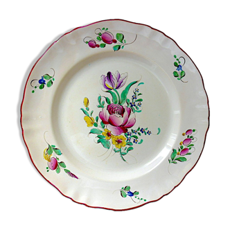 Eastern earthenware plate with floral decoration centered with a rose