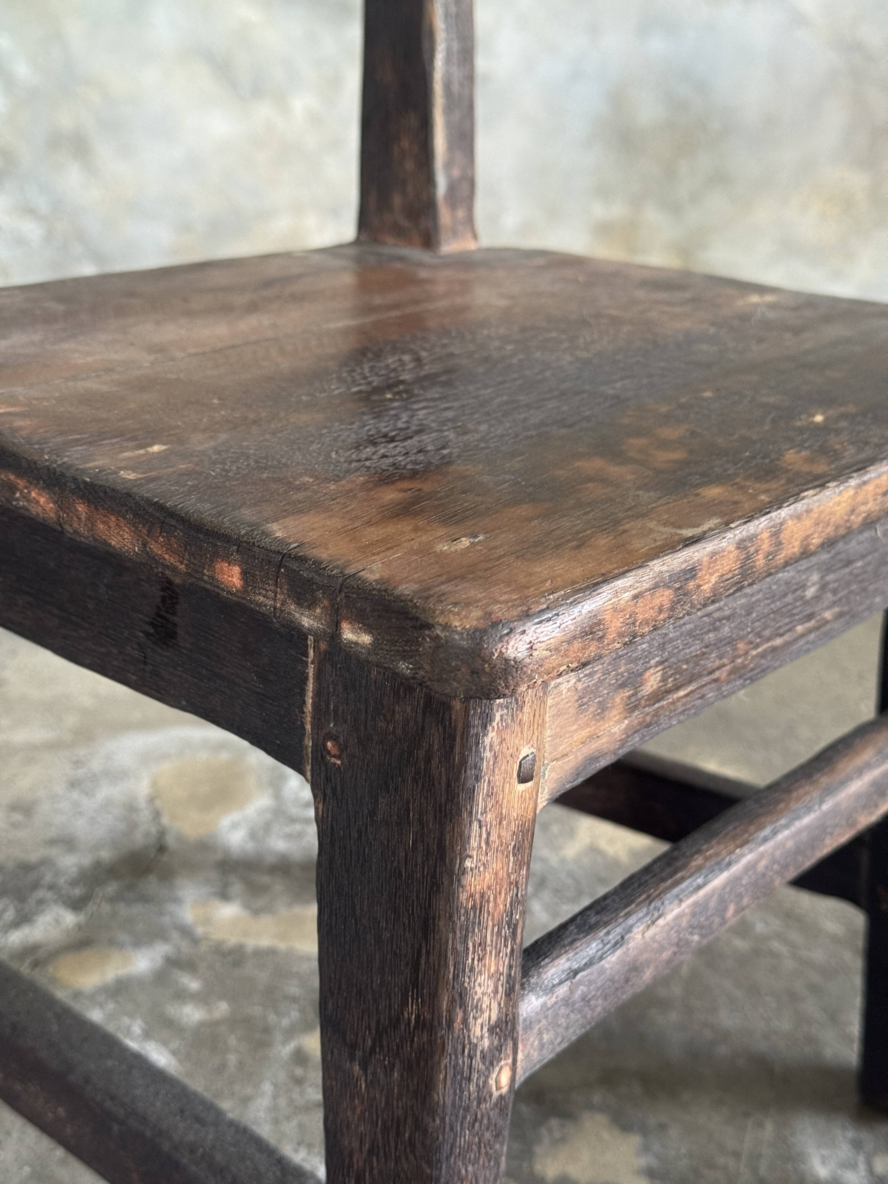 Small antique Indonesian children's chair in teak.