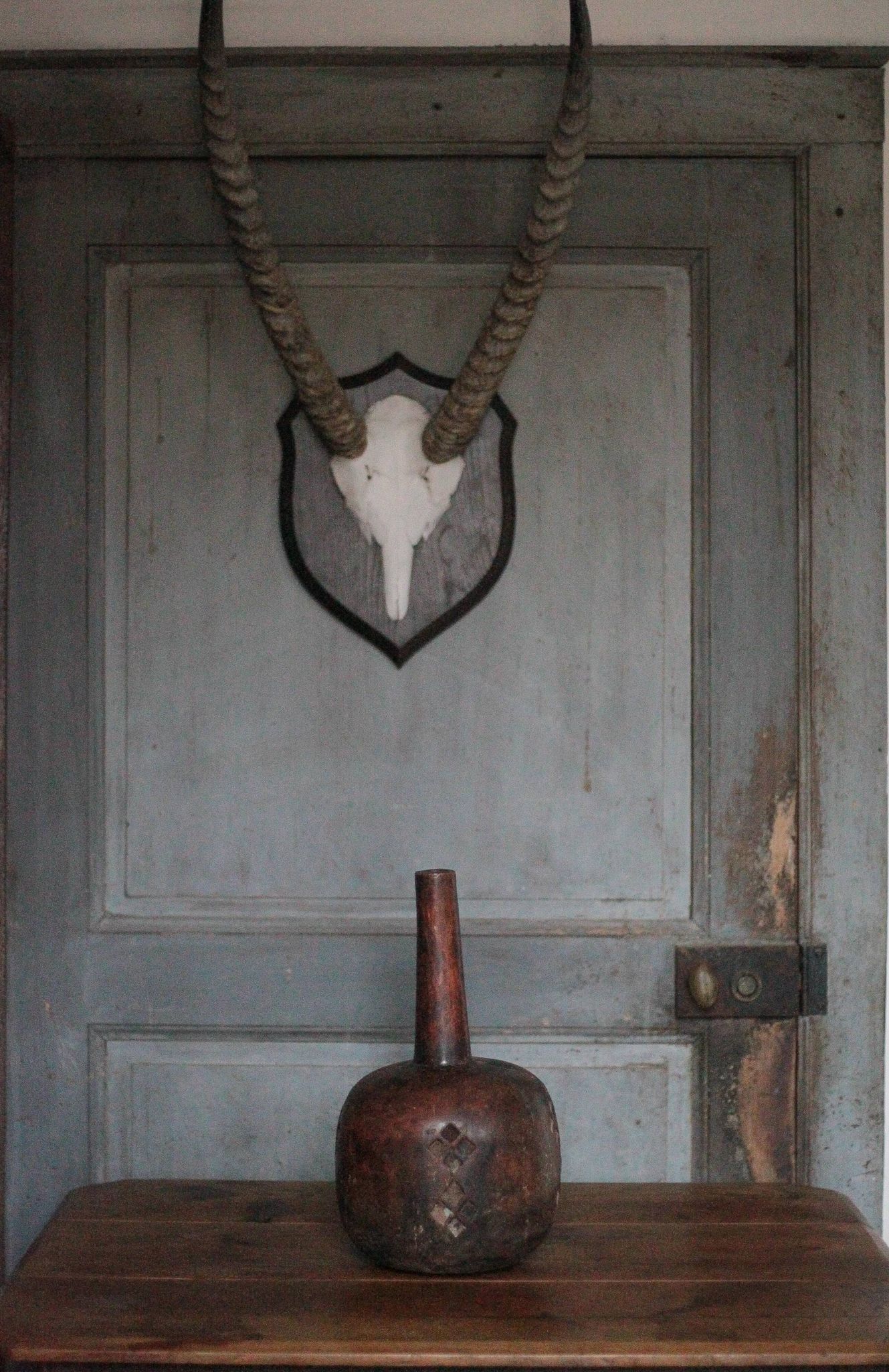 Vintage African wooden carved gourd bottle.