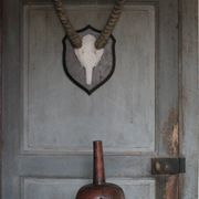 Vintage African wooden carved gourd bottle.