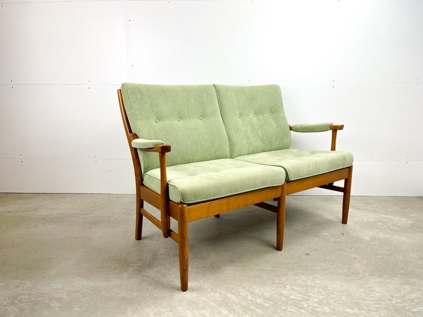Two-seater sofa from the sixties with green upholstery